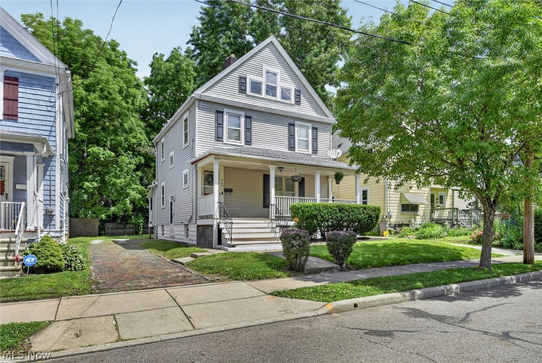 405 Silver St., Akron — Don't let the age fool you — this stunning 3-bed, 1.5-bath century home has been thoughtfully updated while preserving the irreplaceable character that makes older homes truly special. Full renovation completed in 2011 touched nearly every major system: new plumbing, electrical, kitchen, baths, and hot water tank. Roof replaced 2019. Brand new furnace (2025) and new coil & condensing unit (2026) with transferrable warranty — move in and relax. The moment you step inside, you'll feel the difference — soaring coffered ceilings, rich original woodwork, a stunning brick fireplace with wood mantel, and a charming built-in wood bench that you simply won't find in new construction. The dining room continues the warmth with its own window bench and gorgeous millwork. Upstairs, three bedrooms with new carpet, updated fixtures, and fresh paint await, each with deep closets offering excellent storage. The partially finished basement adds flexible space for whatever life demands. And the attic? Already has supply and return air runs in place — essentially ready for finishing. Outside, a grand welcoming front porch, back porch, fenced yard, and brick driveway deliver curb appeal that turns heads. Located in a quiet, prime Akron neighborhood near the Towpath Trail, hospitals, schools, restaurants, and exciting new developments, this home offers both convenience and charm. Homes with this much character, this many updates, and this kind of potential don't last - schedule your showing today before someone else calls it home!