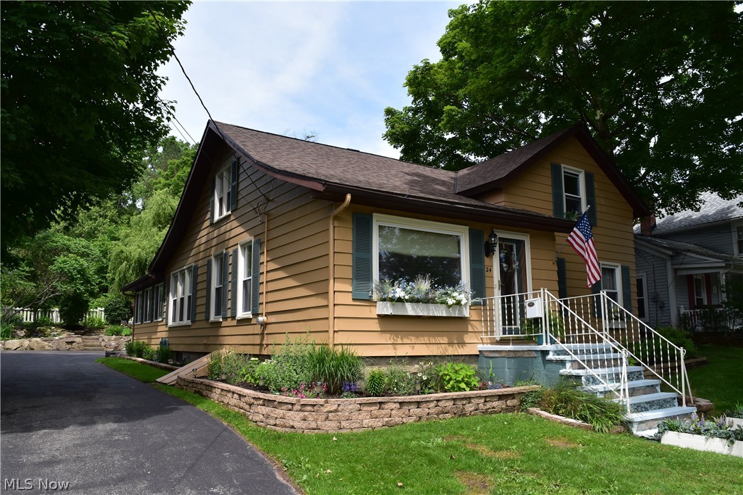 Beautifully Maintained Century Home in the Heart of Chardon Village! This home offers great living space with many charming original features including oversized woodwork & trim, built-in shelving and solid wood interior doors. Updated Eat-in Kitchen with center island, skylights, stainless steel appliances & wood laminate flooring. Family Room with french doors through to Living Room & Dining Room. 1st floor Office. 1st floor Master Bedroom & full bath with oversized ceramic shower. 1st floor Laundry & Mudroom. 2nd floor includes 2 spacious bedrooms & remodeled full bath. All newer carpeting & flooring throughout. Sunroom/breezeway with access to 2-car attached garage & extra-wide paved drive. Stone patio includes Koi pond with waterfall feature & meticulously landscaped yard and manicured beds. Newer Roof. Vinyl windows. 1-yr Home Warranty. Just steps away from Chardon Square, schools, shopping, restaurants, parks & more!