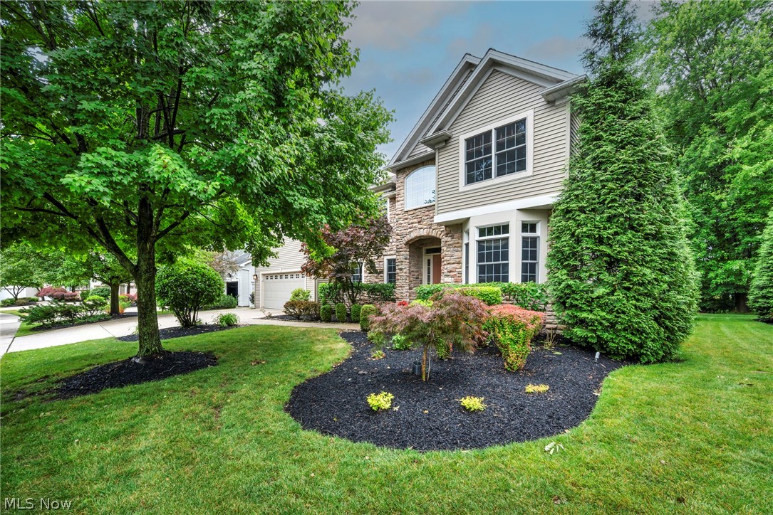 ~Maintenance-Free~ Single family home with over 4,480 square feet of finished space.  Enjoy the freedom of low-maintenance living with no grass cutting, mulching, or snow removal, leaving more time to enjoy everything this exceptional location has to offer. Nestled in the private Heritage Landing community within sought-after Solon Schools, this home offers a peaceful setting, lush landscaping, friendly neighborhood, and convenient freeway/commute access in every direction.

The dramatic step-down great room is the centerpiece of the home, showcasing soaring ceilings, a wall of windows, and a striking fireplace. The eat-in kitchen flows into the formal dining room, with flexibility to expand the casual dining area for larger less formal gatherings. Adjoining family room opens through sliding doors to a handsome stamped concrete patio overlooking the level and mature backyard & playground area.

First-floor primary suite provides convenience and privacy, complete with a walk-in closet and ensuite bath. The main level is finished with a powder room and laundry room featuring abundant cabinetry just off the garage entry.

Upstairs offers tremendous flexibility with a spacious loft overlooking the great room, complete with a large walk-in. Easily transform the loft into an additional bedroom, private office, or relaxation retreat. A connected two-bedroom wing shares a full bath with an additional separate bedroom ~creating the ideal setup for multi-generational living, an in-law or teen suite, extended guests.

The finished lower level expands your living space with a handsome bar area, recreation space, and extensive unfinished storage with room to customize, expand, or create a home gym, workshop, or theater.

Exceptional opportunity combining maintenance-free living, generous square footage, flexible living arrangements, and one of Solon's most desirable neighborhoods. Schedule your private showing and experience everything Heritage Landing has to offer.