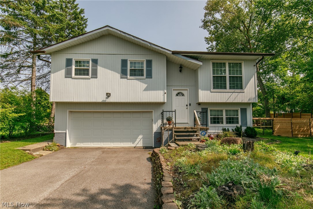 Don’t Miss Out on this Newly Updated Bi-Level Home located in the heart of North Royalton! Greet guest in the 2-Story Foyer. Living Rm is spacious and bright. Newer Eat-In Mocha Kitchen is a cook's delight! New laminate wood floor, cabinets, counter tops, stainless appliances too. Dinette is large and will accommodate Dining Table. 3 Spacious Bedrooms and Updated Bath with Granite Counter complete the 1st floor.  Additional Living Space is in the Finished Recreation/Family Rm with Full Bath (2020) and Laundry Rm.  New Laminated wood flooring in lower level (2020). New Roof, Gutters and Windows (2017). Newly installed front door. New driveway with a convenient turn-around which doubles as extra parking. Newly replaced interior doors and trim! Large 24'x13' stamped concrete patio overlooking the private fenced wooded backyard (2020) and Newer Deck is perfect for playtime, entertaining and BBQs. Large 2 car attached garage with new garage door and so much more! Buyer Home Warranty too. Aw