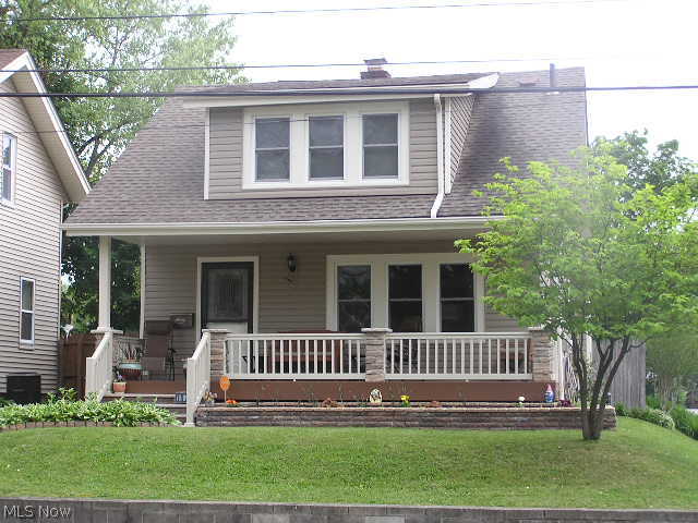 One word says it all '...WOW!'  Exceptionally well maintained, nicely landscaped yard, totally rebuilt 'maintenance free' front porch.  Vinyl siding and windows.  Gorgeous hard wood floor on first floor, spacious dining room with built in drawers, beautiful front door.  large dining room with artificial fireplace with electric heater.  All exterior walls have been insulated.  Central air plus all rooms have ceiling fans.  Fenced yard with deck...a must see!  Remember that if you snooze, you lose!