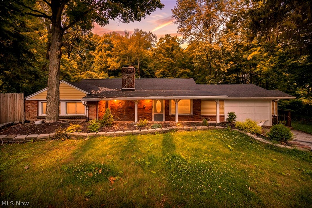 Opportunity awaits with this 3-bedroom ranch home featuring a walk-out basement in the heart of Bedford! Nestled on a beautiful lot that backs to peaceful woods, this property offers privacy, a serene setting, and plenty of potential for its next owner.

The home is ready for your personal touches and TLC, making it a fantastic opportunity for investors, first-time buyers, or anyone looking to build equity. Enjoy relaxing on the covered front patio, gather around the backyard fire pit on cool evenings, and appreciate the convenience of the attached 2-car garage.

Located in a welcoming community with easy access to I-480 and other major highways, commuting is a breeze while still enjoying all that Bedford has to offer, including parks, shopping, dining, and local amenities.

Bring your vision and make this ranch your own!