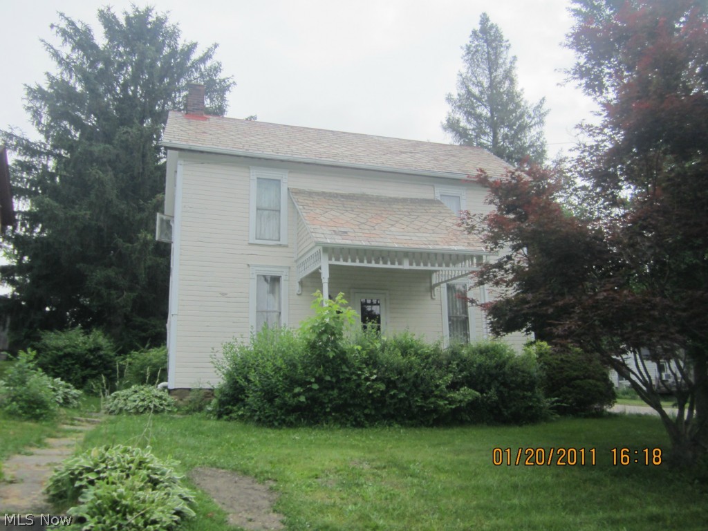 Nice corner alley lot.  3 large bedrooms;  All original woodwork.  Large kitchen which includes stove, refrigerator.  First floor laundry with gas dryer.  Property is being sold as is.  Electric budget $34; Gas budget $82.  Taxes are only $99 per half.