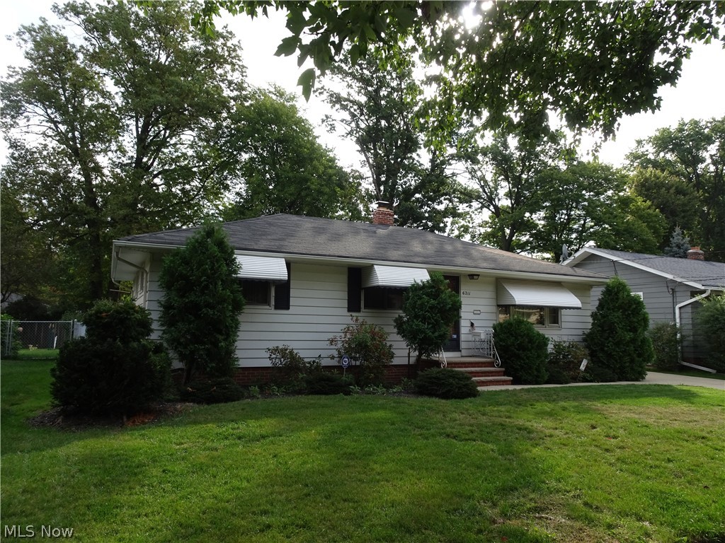 Ever want to go back to a simpler, easier time? Well, we can't do that, but this amazing 3 bed 1.5 bath Ranch can help set the scene. Fresh concrete, detached side load garage, fenced yard with a deck; that's just the outside! Open floor plan kitchen (all appliances), dining room w/wainscoting, french doors to the deck, hardwood flooring throughout, full bath with jetted tub (and a bath 1/2) plus a classic "Parma Kitchen" IN THE BASEMENT - picture the set of "Mad Men". Meet Don Draper at the wet bar for a quick one and then it's off to the boardroom to hammer out your offer! SPECIAL BONUS: full workbench, newer HVAC and a cedar closet/humidor in waiting! A MUST SEE!!