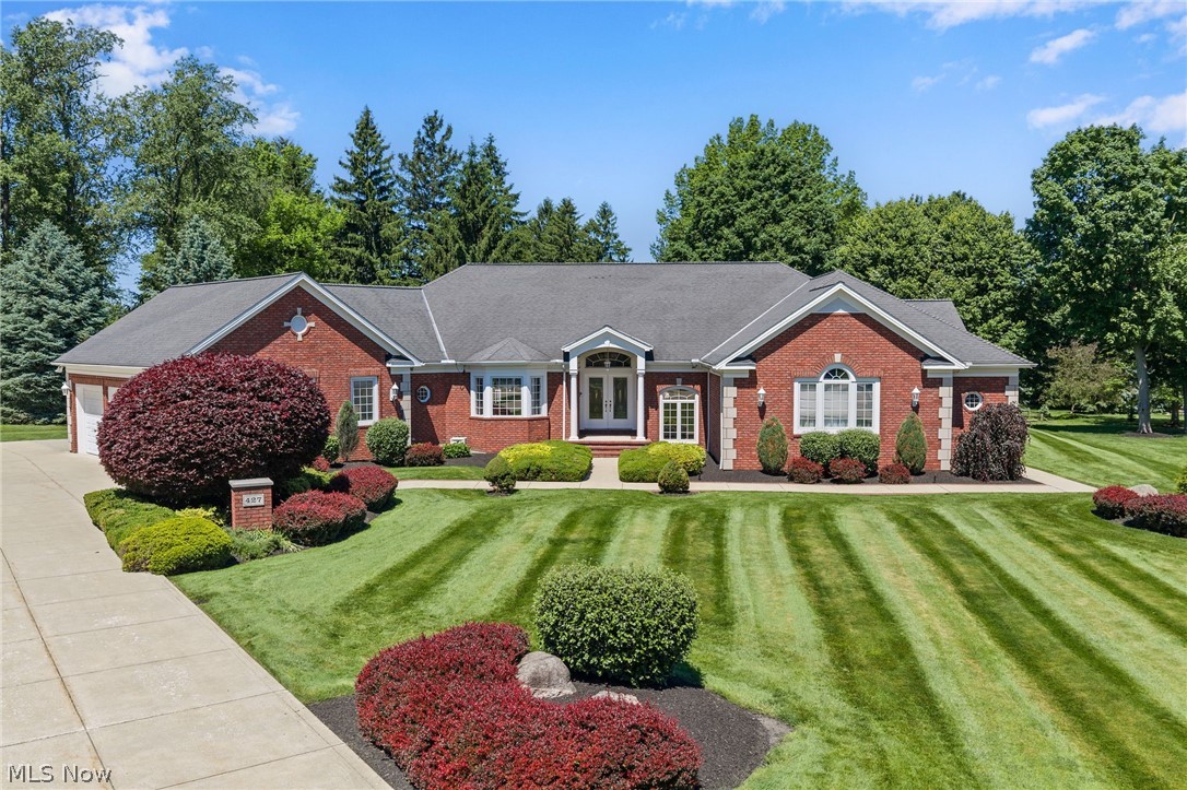 A rare offering in one of Highland Heights' most sought-after luxury communities, the  prestigious Deveron Estates. Custom designed by architect Bill Childs & built by Mark Ange, this stately & elegant one-family-owned Ranch offers over 7,154 sq ft of impeccably maintained living space on a quiet cul-de-sac setting. Showcasing timeless architecture & exceptional craftsmanship, the home features soaring vaulted, tray & wood-trimmed barrel-vaulted ceilings, stately columns, extensive millwork, hardwood flooring & an open-concept design ideal for everyday living & entertaining. A dramatic foyer opens to expansive living spaces filled w/ natural light. A vaulted great room features a fireplace, custom entertainment center & oversized windows overlooking beautifully landscaped grounds. An eat-in kitchen offers vaulted ceilings, quartz countertops & backsplash, double wall ovens, center island w/ breakfast bar, built-in desk & spacious dining area w/ access to the patio. A versatile room w/ tray ceiling, built-in cabinetry & bay window provides options for a music room, sitting room, or formal dining room. The primary suite is a private retreat w/ walk-in closet & spacious bath w/ dual vanities, soaking tub & separate walk-in shower. A 2nd bedroom suite includes a walk-in closet & private bath. The finished lower level expands the home's versatility with a large recreation area, theater room w/ wet bar, office, fitness room, bonus rooms & full bath. Outdoor living is equally impressive w/ a multi-level patio, dedicated firepit gathering area & a private backyard setting surrounded by towering trees. Additional highlights: heated 3-car garage, 1st-floor laundry w/ custom cabinetry, mudroom w/ built-in bench, fully illuminated attic spanning the length of the home, full-yard irrigation system, exterior gas line, 13-course basement, 2 A/C units & water heaters, 8-ft garage doors & so much more. A truly exceptional residence!