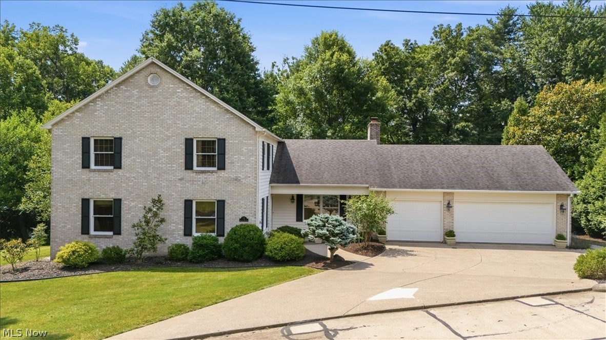 Offered for the first time by its original owner, this beautifully maintained custom brick and cedar home, built in 1994, is nestled on a private, wooded half-acre lot in one of the area's most sought-after neighborhoods.  With over 3,500 finished square feet of thoughtfully designed living space, this exceptional residence offers the perfect balance of privacy, comfort and convenience.  
Inside, you'll find a welcoming formal entry, spacious family room with gas log fireplace, an added (25 X 16) Beautiful Four Season Room, formal living room, office/den with built in shelves, kitchen (with abundant counter space, cabinetry, island and table space), formal separate dining room, half bath and first floor laundry. The second floor offers a master suite with a large master bathroom, three nice sized bedrooms and hallway bath.  The well-designed floor plan provides generous living and entertaining spaces, making it ideal for both everyday living and special gatherings.  Exterior amenities include a front covered porch, rear covered deck and newer open tiered deck. Surrounded by mature trees, the backyard provides a serene retreat with exceptional privacy while still being just minutes from shopping, dining, schools, and everyday conveniences.  Also included is an attached three car garage, gas grill hook up on deck and unfinished walk out basement. Roof, furnace and air all less than ten years old. If you've been searching for a move-in-ready home in an established, highly desirable neighborhood, this original-owner property is a rare opportunity you won't want to miss.