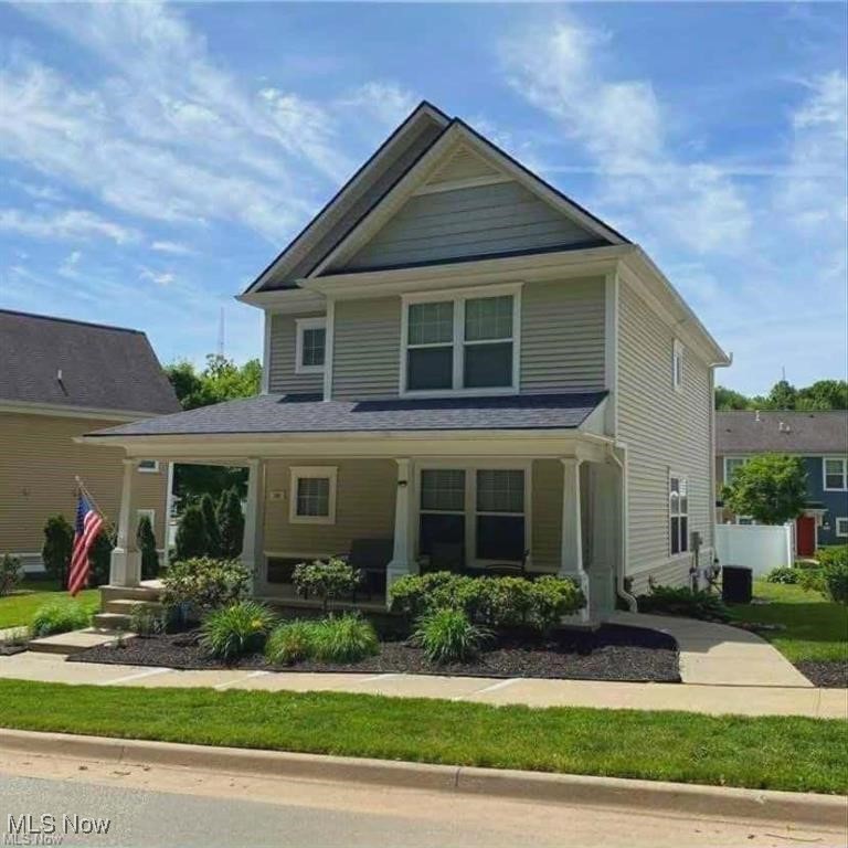Built in 2006 and meticulously maintained, this move-in-ready 4-bedroom, 3-bath Colonial offers the ideal blend of space, comfort, and commuter convenience just minutes from Downtown Akron’s medical and civic corridor. With 2,352 sq. ft. of finished living space — including a professionally renovated lower level (2023) — the home easily accommodates shift-based schedules, guests, or multi-generational living. The open-concept main level centers around a modern kitchen with an oversized island seating five, seamlessly connecting to the Great Room — perfect for relaxed evenings or hosting colleagues and friends. Upstairs, the primary suite features a walk-in closet and dual-vanity bath, while the finished lower level adds a private bedroom, luxury full bath, and expansive rec space ideal for a media room, fitness area, or quiet retreat after long shifts. Outside, enjoy a welcoming wraparound porch, partially fenced yard, and attached 2-car garage. Located in a peaceful residential pocket with immediate access to Route 8, I-76, and Downtown Akron, the home sits moments from Elizabeth Park with it's own water spray park, the Towpath Trail, Little Cuyahoga River, and nearby recreation amenities — offering rare green-space access near the city’s employment core. Ideal for Cleveland Clinic, Summa Health, Akron Children’s Hospital, and municipal professionals seeking newer construction, low-maintenance condition, and efficient commuting. A rare combination of condition, location, and lifestyle access in Akron’s central corridor.