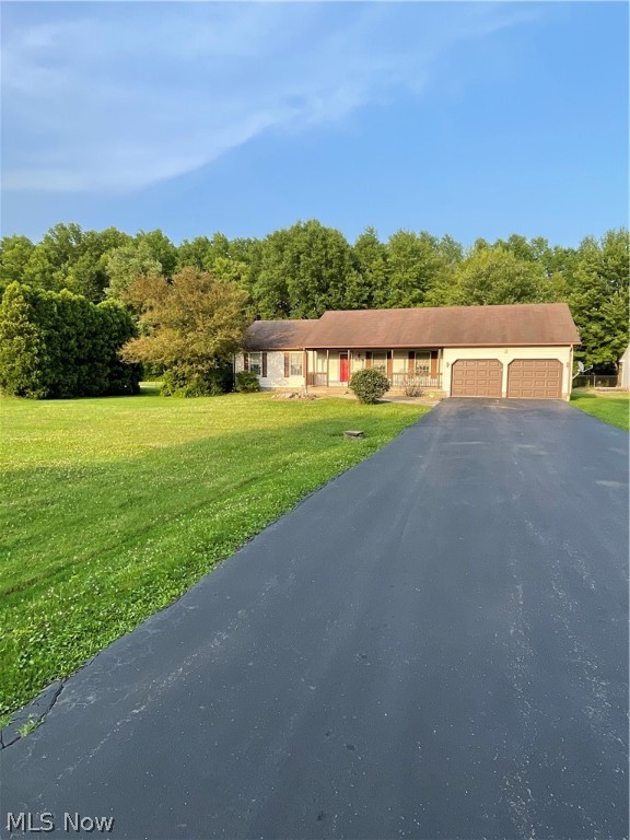 One floor living in Champion school district on .08 acres in a country setting! Master suite with walk in closet. HUGE family room with deck leading out to partially fenced backyard. First floor laundry. Home Warranty included! Call for your showing before its gone!!