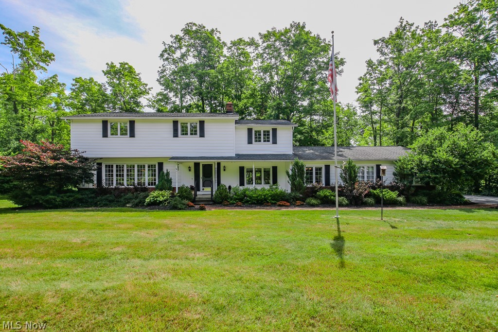 Welcome to this beautiful one owner colonial nestled on a lovely wooded lot. Enter from the inviting front porch to the huge living room with bay window opening to the formal dining room. The spacious eat in kitchen with all appliances overlooks the backyard. You can watch all the birds as the maple syrup is being boiled in the sugar shack in the yard. The grand family room will be where everyone spends their time with a WBFP, windows overlooking front & back of property & an area for your home office . A complete laundry room  w/ extra refrigerator & a half bath are also located on the 1st floor. On the second floor there are 4 big bedrooms including a spacious BDRM w/ ensuite full bath & huge walkin closet. The other full bath has a walkin shower & double vanity. The Rec room downstairs has lots of room for games as well as area for storage.  There is an expansive deck overlooking the beautifully landscaped oasis in the backyard. A full house generator for peace of mind. Located on a quiet cul de sac street, the home is close to highways, schools & shopping. Come home to the country, close to everything historic Chesterland has to offer.