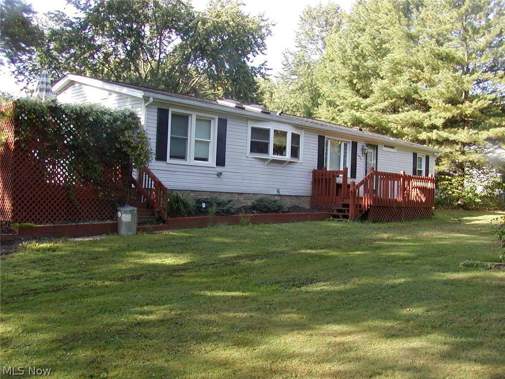 Own you own mini farm. Perfect setting.  6.8 acres great for farming, horses or just plenty of wide open space plus beautifully updated  home with vaulted ceilings.  Newer applianced kitchen with granite counters and  loads of cupboards. Newer tilt-in windows for easy cleaning, beautiful composite deck added in 2016. Gutter guard on house and garage.  Master bedroom with updated master bath with jetted tub and bamboo flooring & separate  shower stall. Walk-in closet included in the size of the master bathroom.  House roof about 9 years old, garage & shed roofs under 2 years old.  Wood flooring in 2 bedrooms, living room, family room and dining room is manufactured hickory wood. 3rd bedroom is also wood. Hot water tank--3/2016.  Partial basement for storage. America's Preferred Home Warranty is included.  Easy to show.