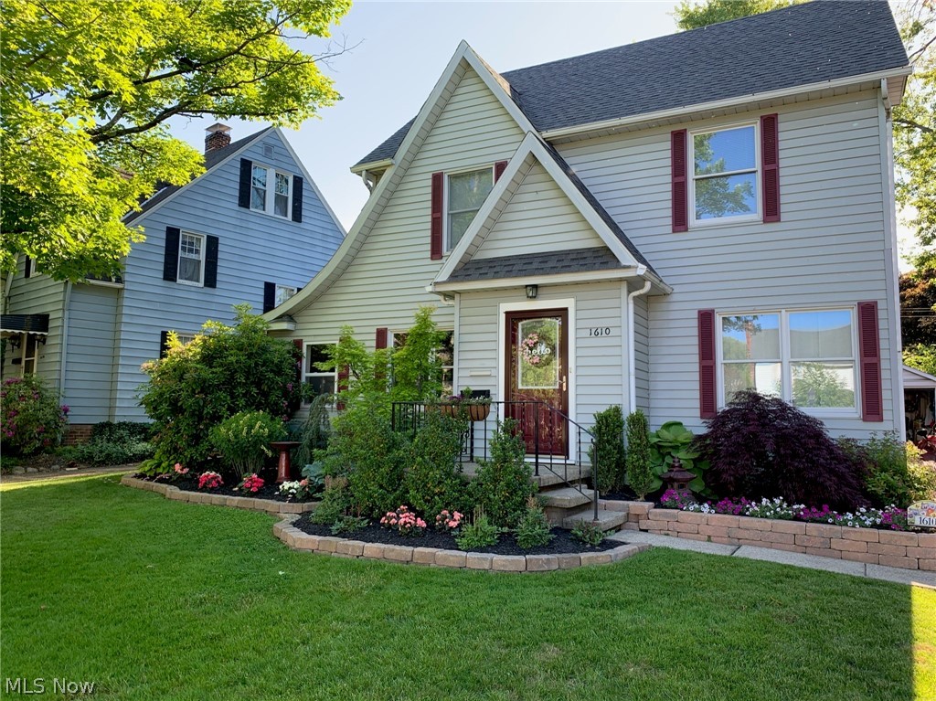 An absolutely stunning Cuyahoga Falls Colonial west of State Rd.   With 4 bedrooms (one being the finished attic space) and 2 full baths, this almost 1800sq ft home is in immaculate condition.  The old 1930 charm is kept with the natural wood floors, yet modern with an updated kitchen and baths.  The large living room has a fireplace, and wood floors run throughout the living room and dining room.  The updated kitchen has granite countertops.   A library/office and an enclosed rear porch are also on the first floor.  The second floor laundry coincides well with the nice sized bedrooms and 24x11 finished attic space with immaculate knotty pine.  A wonderful rear patio, fenced back yard, 2 car garage, a full basement, and so much more.