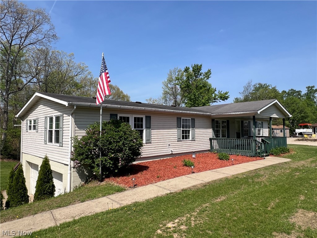 Check out this spaceous 1,848 square foot, three bedroom, two and one half bath home at Seneca Lake with just over an acre of private land. Conveniently located just past Seneca Lake Dam and just a short distance to the boat launch ramp and marina. Covered front porch with lake view. Large rear deck with private wooded view. New carpet and vinyl flooring throughout. New aerator motor. Mineral rights are leased and will transfer to the buyer. All appliances will remain.