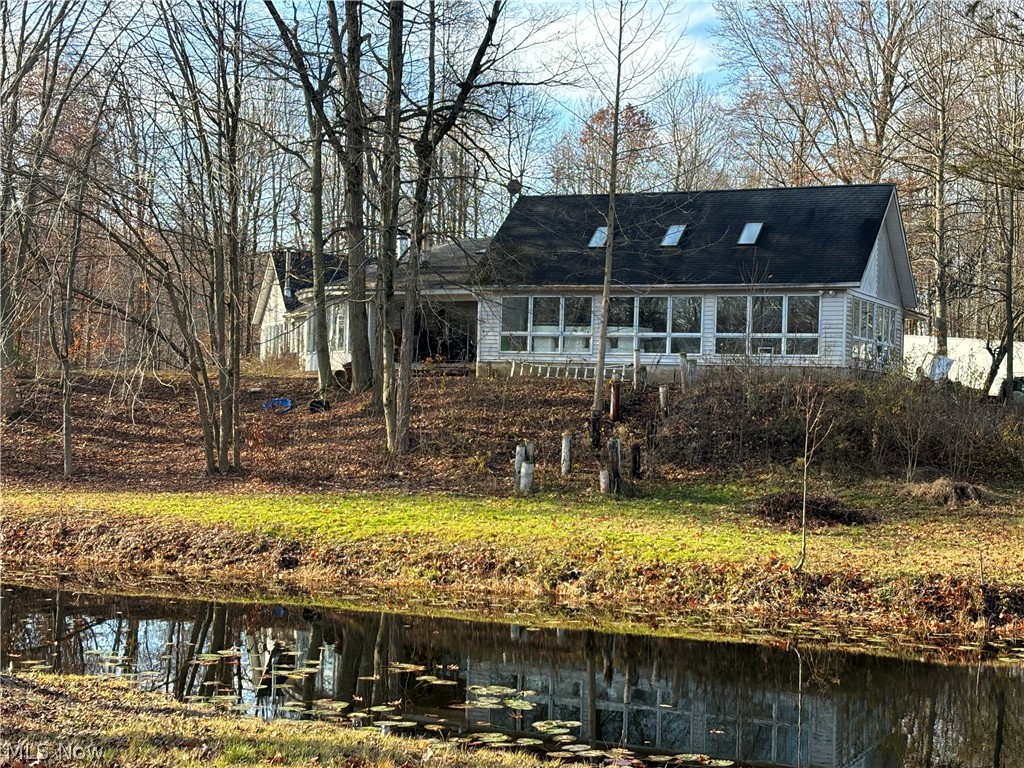If you've always wanted your own secluded sanctuary then look no further. Contemporary, open concept home that overlooks a fabulous pond that attracts wildlife. The kitchen boasts appliances that are a chefs dream. Ample cupboard space and large pantry. Stainless appliances and double dutch oven. The large Master suite has walk in closets and a private glass block bathroom. Enjoy a relaxing evening in the jetted garden tub overlooking your private, wooded, retreat. The indoor pool will be great for entertaining year round. The lower level is a walk-out and can be converted to a bonus living area. By appointment only. Do not enter the property without your agent. Audio and video surveillance. Camera's on all points of properties. DO NOT WALK OR ENTER PROPERTY WITHOUT AN AGENT. Guard dogs on duty. May bite.