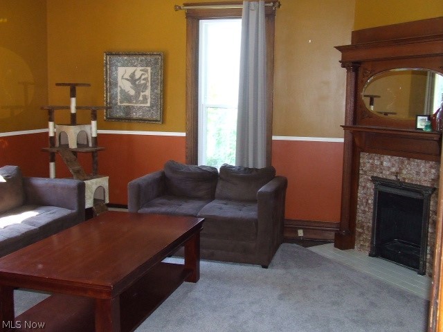 Beautiful Colonial with tons of Charm, waiting for your loving touches to bring it back to full glory!!  Interesting first floor with lots of possibilities includes living room with beautiful, original, ornate tile and wood fireplace.  There is a large dining room with built-in butler pantry and shelves, and a huge first floor bedroom.  Charm abounds from the several sets of tall pocket doors with engraved hinges to the great, wide oak woodwork, stained glass window, and two-toned hardwood floors.  The kitchen was previously updated with cherry cupboards and 2017 stainless steel appliances (dishwasher older).  There is also a full bathroom on the first floor and an enclosed porch/mudroom.  Upstairs are 3 more bedrooms, 2 with walk-in closets, and another full bathroom that was redone in 2018, including a soaker tub.  There is a "bonus" room that previously was a 2nd kitchen, still has sink and small stove (disconnected), gas line still plumbed. There's also a large landing at top of st
