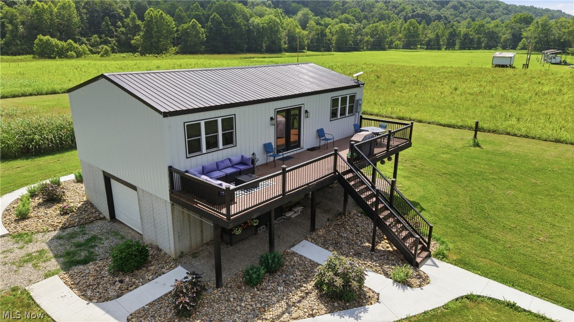 Riverfront Retreat or Turnkey Airbnb!  What more could you ask for?  The bonus of just under 9 acres!

Built in 2024, this beautiful raised ranch is the perfect getaway, full-time home, or income-producing Airbnb.  The house is 960 sq. ft. with the same size below for garage space.  Enjoy the outdoors from the 40-foot back deck overlooking the river or relax around the wood burning fire pit after a day on the water.

Inside, you'll love the cathedral wood ceilings, beautiful butcher block kitchen, and quality craftsmanship throughout.  No detail was overlooked.  Each bedroom has a private full bathroom. Owners are leaving it beautifully furnished.  Just bring your suitcase.  With modern amenities, 200-amp electrical service, Starlink Internet, and a public boat dock nearby, this property is ready for fishing, boating, entertaining, or simply unwinding.