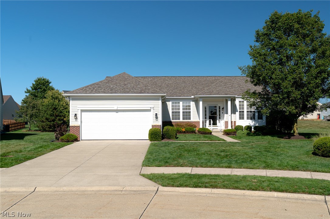 Welcome to North Ridgeville’s Premier Del Webb Active Adult community! This highly sought-after model stands out with a rare full basement and 4-foot extended garage perfect for storage, hobbies, or larger vehicles. While similar models have sold on busy corner lots with confined backyard space, this home stands apart, a rare setting positioned at the end of a quiet cul-de-sac with an expansive open green space behind it providing enhanced privacy, scenic views, and a tranquil setting you and your guests will enjoy for years to come! Inside, enjoy an open-concept layout with a spacious eat-in kitchen featuring hardwood floors, abundant cabinetry, a center island, pantry, and newer stainless steel appliances. A versatile front room with double doors is ideal for a home office or private retreat. The bright family room flows into a sun-filled sunroom, perfect for relaxing and taking in the peaceful views. The owner’s suite features a spa-like bath with soaking tub, separate shower, linen closet, and two walk-in closets. A split-bedroom design with a full bath offers added privacy for guests. Major updates provide peace of mind, including a new roof (2025), furnace (2024), hot water tank (2018), plus a freshly painted garage with a durable polyaspartic floor. Enjoy the maintenance-free living with resort-style amenities, including a 14,000 sq ft clubhouse, indoor & outdoor pools, pickleball courts, fitness center, and a full calendar of social activities. Conveniently located near highways, major medical facilities, shopping, and dining. This home blends comfort, convenience, and an exceptional home site! Schedule your private showing today.