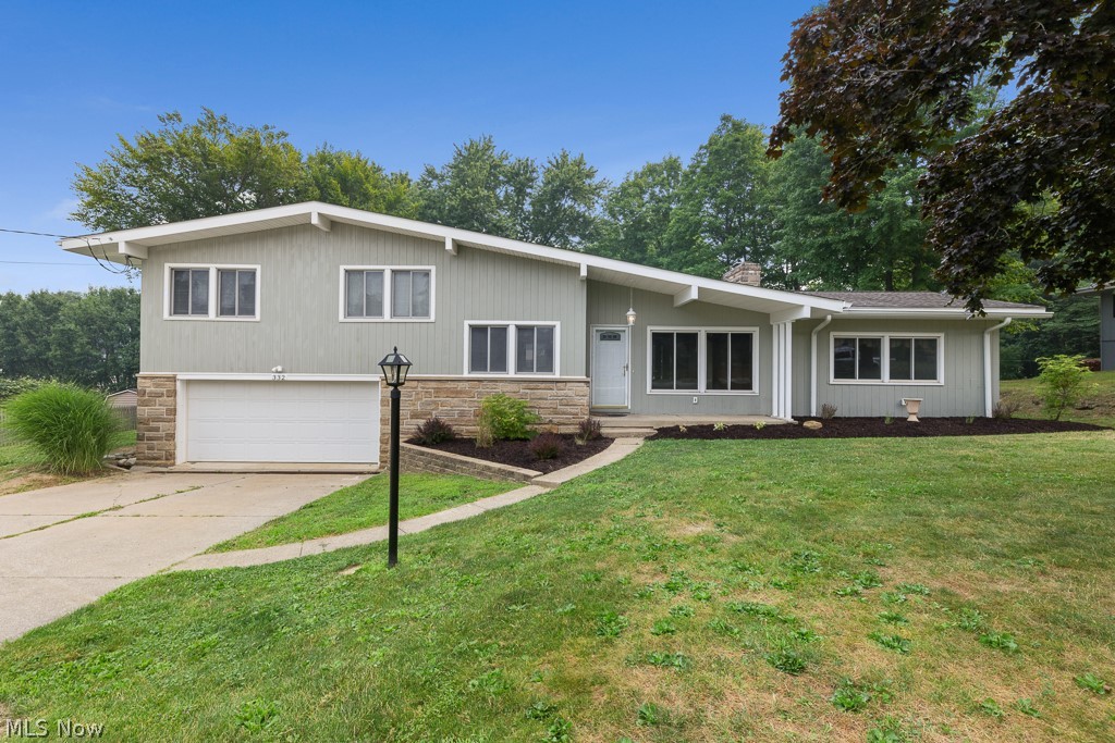 You have to see 332 Smith Drive in Tallmadge! This spacious split level home offers 3 bedrooms, 2 bathrooms, and 1,917 square feet of living space on a generous 0.46-acre lot. The inviting interior features multiple living areas, a cozy fireplace, central air conditioning, and a finished lower-level space that provides added flexibility for entertaining, a home office, recreation room, or additional living space.

Outside, enjoy a sizable yard for gardening, swimming or entertaining. An attached two car garage adds convenience and additional storage. This home offers a great combination of space, functionality, and opportunity for the next owner to make it their own.