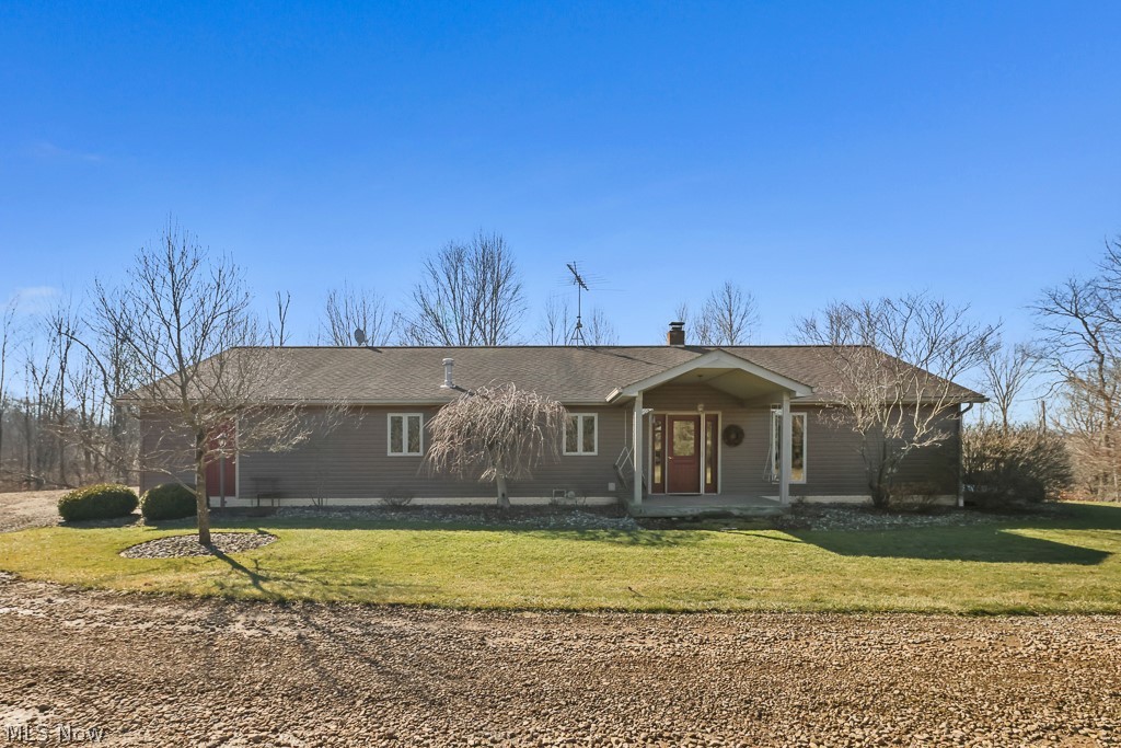 A little piece of paradise for you. 6 acres and FREE GAS! Custom built home on a beautiful creek, overlooking woods and wildlife galore. 3-4 bedrooms, 2 full baths. Lovely great room/kitchen -dining combination with cathedral ceilings. First floor master bedroom, bathroom and laundry room. The lower level has a beautiful rec room, office and a walk out basement into the great outdoors! Two car large attached heated garage. This home is truly unique and offers an abundance of possibilities. One owner home,quality built and very well taken care of. Call for details or a private showing. This is a peaceful getaway just a few miles from Alliance.