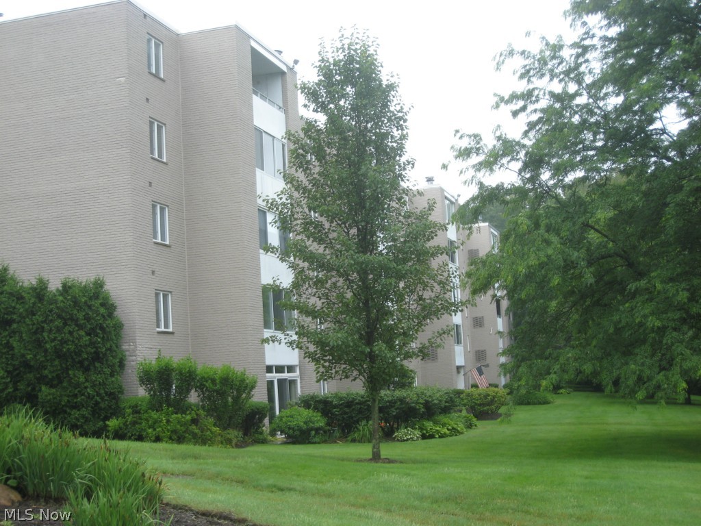 Nestled in the trees, this end unit overlooks the park on 2 sides.  Walk in to the foyer of this beautifully maintained unit that has been thoughtfully improved.  The seller wanted to take advantage of the end location and views of nature, so opened the porch and made it year round and open to the living room.  At the other end of the living room, made a cozy family room/office that could be a small bedroom.  Gorgeous cherry kitchen with lots of cabinet space and countertops.  Newer appliances, too!  Good size master bedroom with walk in closet.  In suite laundry with stacked washer/dryer combo stays.  Amenities include Community Room, Exercise Room, Library/Craft Room and pool.  All utitlities included except for sewer which is a quarterly bill. This is a secure building with inside parking.   This is a beauty.  Call to see.!