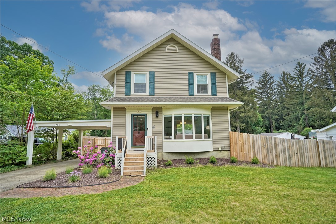 Absolutely charming colonial with an amazing covered deck and private .86 acre backyard that backs up to the park and is fenced in. Spacious living room features beams, built-ins, wood burning fireplace, bay window, and beautiful hardwood flooring. The dining room also features built-in's and is open to the kitchen complete with an island and access to the back deck.  The bedrooms are good size and there's even a finished attic - perfect for a bonus room.  The finished lower level includes a bar area, a large rec room, and an additional full bathroom. Updates include: A/C - 2020, fence, gutters w/ guards, patio, and carport roof - 2019, hot water tank - 2017, and the hardwood floors were refinished in 2016.  Two car garage plus a carport.  Walking distance to restaurants and shopping.