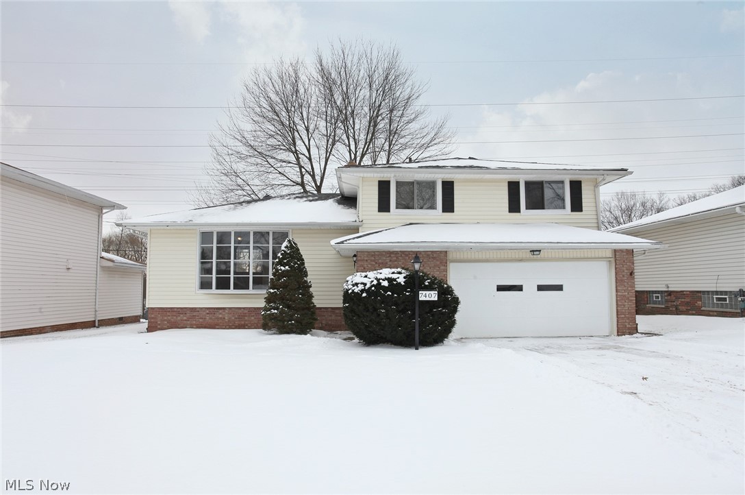Welcome Home! This updated south Parma two-story home is waiting for you to move right in! Walk in to the family room and enjoy beautiful hardwood flooring and lots of natural light from the front picture window. Make your way to a spacious kitchen complete with newer stainless steel appliances, updated counter tops and cabinets, backsplash and newer flooring. The lower level boasts a wood burning fireplace and a walkout to the back yard. The second floor features three bedrooms including a full bathroom. Numerous upgrades include fresh neutral interior paint and updated fixtures. The large fenced back yard features a shady open porch which makes a great spot for relaxing. Do not miss out on this home, call for your private showing today!