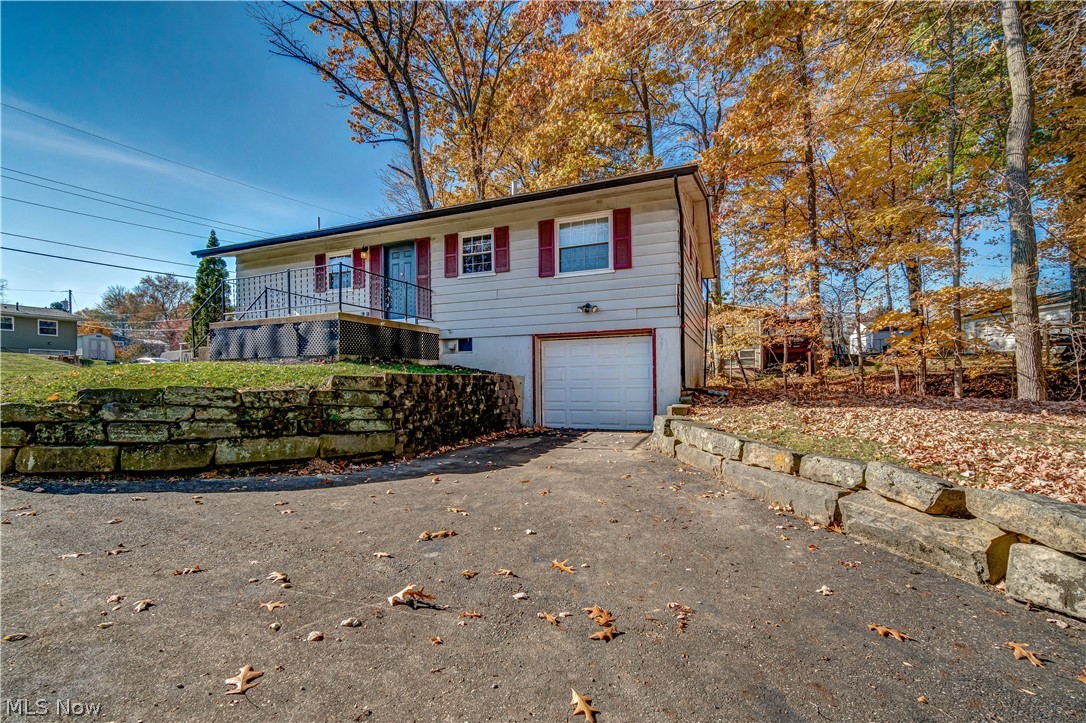 Welcome home to this tastefully updated 3 Bedroom ranch home in the heart of Mayflower Village! Entering the front door, you'll be greeted by an open floor plan highlighted by an updated kitchen with large island, soft close Kraftmaid cabinetry, newer LVT flooring and plenty of natural light. All three bedrooms are on the main floor and each has ample closet/storage space. The main bathroom features a double vanity and updated tub/shower surround. Heading downstairs, the partially finished walk-out basement boasts a rec room with large windows and a wood burning fireplace to melt away that winter chill. This home is uniquely situated on a 0.38 acre lot with plenty of mature trees and a wooded area for the kids to explore right in their own backyard. Schedule you own private showing today before this one is gone!