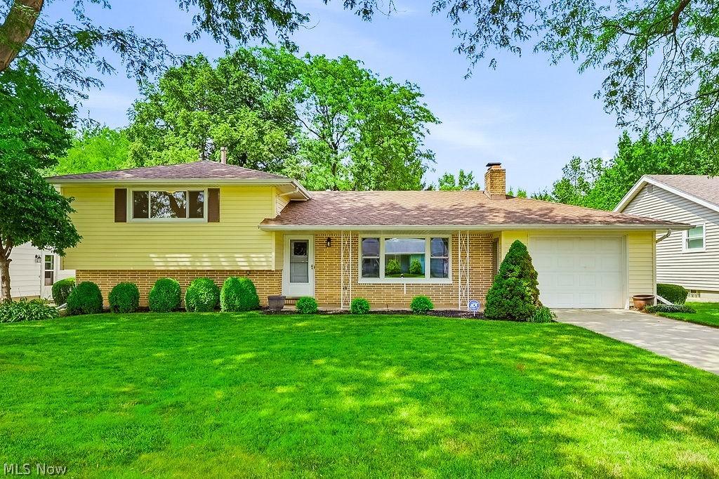 Welcome home to 1812 E.Skyline Drive, Lorain! If you've been searching for a move-in ready split-level home, you'll immediately apprecitate the pride of ownership found throughout this lovingly maintained, one-owner home. Thoughtfully cared for since it was built, this inviting property offers the perfect blend of comfort, flexibility and peaceful surroundings. The main level features a bright living room centered around a cozy wood-burning fireplace, along with a kitchen and dining area designed for easy everyday living and entertaining. Just off the kitchen, the spacious wood-walled three-season room extends your living space and overlooks the backyard. Whether you're enjoying your morning coffee, hosting family and friends, or simply relaxing, you'll love the view. Even better, the property backs to a protected nature area, offering added privacy and the peace of mind that no future development will be built behind you. Upstairs you'll find two comfortable bedrooms and full bathroom. The lower level offers execeptional flexibility with a spacious bonus room perfect as a family room, home office workout space or potential third bedroom. It also connects to the laundry room and an additional bathroom. A welcoming covered front porch provides another place to relax and enjoy this quiet neighborhood. Whether you're buying your first home, looking to downsize, or searching for a home that's been exceptionally cared for, this one offers outstanding value. Conveniently located just minutes from Lake Erie, shopping, restaurants, parks, schools and major highways, you'll enjoy the best of both convneince and tranquility. If you're searching for a well-maintained home in Lorain, a split-level home with flexible living space, or a property that combines privacy, move-in ready condition, and a great location, 1812 E.Skyline Drive deserves a place at the top of your list. Come see why this special home has been so well loved, and imagine the memories waiting to be made here.