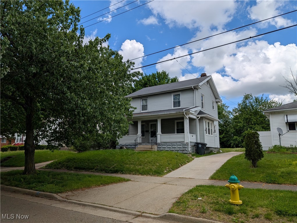 369 Montrose Ave, Akron, Ohio 44310 is a super cute 2 story Colonial home in the North Hill area of Akron on a gorgeous tree lined street! Lots of beautiful natural wood for charm! The home has a great front porch to sit on in the mornings and evenings, good sized yard, its own driveway and has a newer furnace and tenant keeps it looking nice! The tenant has been there for several years and wishes to stay if possible. The tenant pays $950 per month plus all utilities and has been a great tenant. The lease is currently set to end on June 30th but again, he would like to stay if another investor purchases the property. This is a 2-bedroom home where both bedrooms on the 2nd floor are larger than typical and a full bathroom is also on the 2nd floor with a tub & shower combination. The 1st floor has a beautiful living room with natural woodwork as well as a separate dining room that is also gorgeous. The kitchen is perfect for this size home and has a stairwell to the basement or to the rear small porch and back yard for your toys and fun with plenty of grilling and entertaining space. The unfinished basement level is clean with a double utility sink and laundry hookups. The roof, siding and windows have all been updated. Don't miss this opportunity to own a great 2-bedroom home in North Hill, whether you are a 1st time investor since there is a built-in tenant, a seasoned investor, or if you wish to buy for yourself and occupy after the lease ends on June 30th.  Please note that there is no garage at this property and a single wide concrete driveway. There is also on-street parking available as well. Property is being sold as part of properties that are being sold to close out an investor's portfolio. Property also has a 1-year warranty for peace of mind for the Buyer, set your showing through your favorite professionally licensed real estate agent or call the listing agent; a couple of hours notice would be appreciated by the tenant!