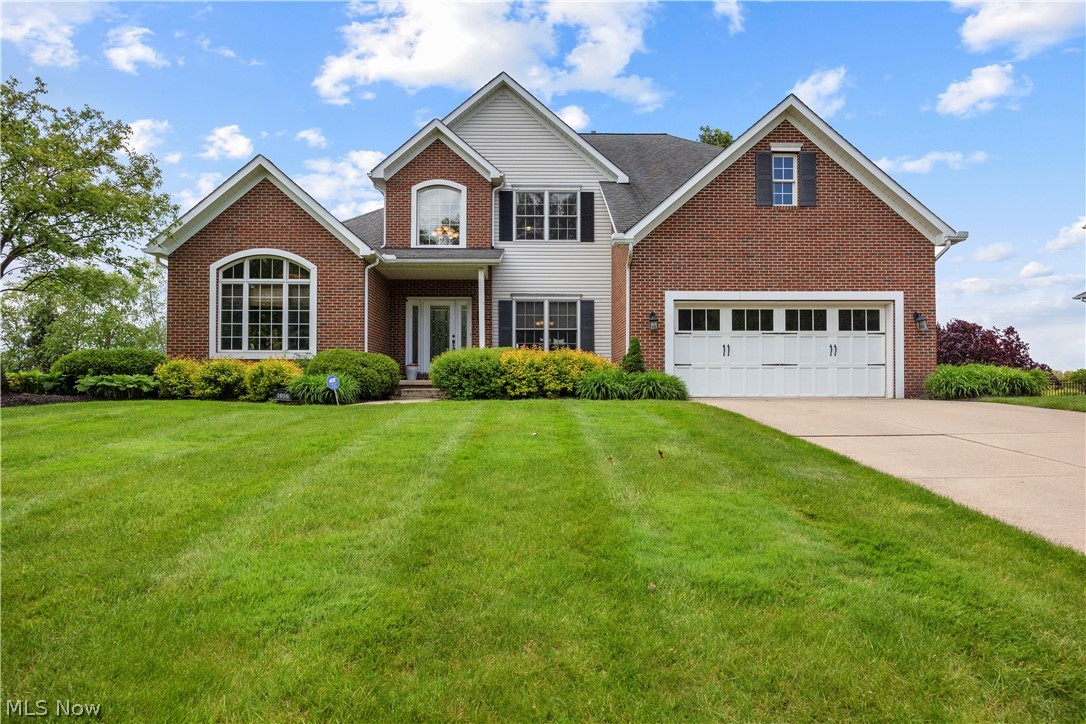 Welcome to 1056 Brigantine Ave. in desirable Uniontown, Ohio — a stunning custom-built Schumacher Homes residence offering over 4,900 finished square feet of beautifully designed living space, breathtaking views, and exceptional upgrades throughout. Situated on a spacious .33-acre lot, this meticulously maintained home blends luxury, comfort, and functionality. The bright, open layout features a private first-floor master suite with a spa-like bathroom, walk-in shower, and oversized walk-in closet. Spacious living areas flow seamlessly into the formal dining room and dedicated home office, perfect for entertaining and everyday living. The beautifully appointed kitchen offers quartz countertops, abundant cabinetry, a large pantry and access to the sunroom and outdoor living spaces. Enjoy stunning views from the sunroom or expansive Trex deck complete with a direct gas-line hookup for grilling. Additional conveniences include first-floor laundry, central vacuum, smart thermostat technology, and a full irrigation/sprinkler system. The finished walkout lower level adds approximately 1,685 square feet of exceptional living space, including a recreation room, full bar, exercise room, media/theater room, and a fourth full bathroom — ideal for entertaining. Major updates include two new furnaces (2022), new A/C (2022), hot water tank (2021), and water softener (December 2025). This exceptional property offers luxury finishes, thoughtful design, and modern amenities in one of Uniontown’s most sought-after locations. Call today for your private showing.