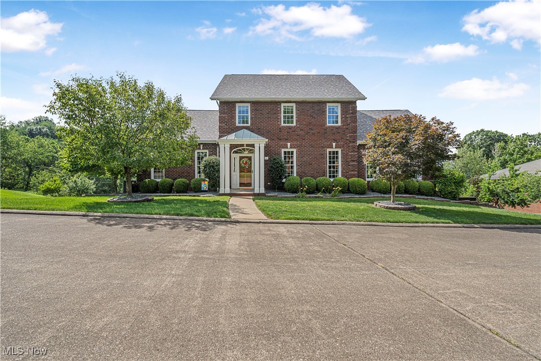 Prestige is the word to describe this listing. Only viewing it yourself will let you experience the unique dental work of the trim, the custom designed kitchen and the exquisite dining room. The master bedroom welcomes you personally with his and her walk-in closets, jetted tub, and the travertine shower. Each bedroom upstairs features its own personal full bath.  The finished basement holds true for a mother-in-law suite or a private office. And, last but not least; the evening view from on top of the West Virginia Hills shows truly the breath taking almost heaven WV.  Schedule your private showing today.