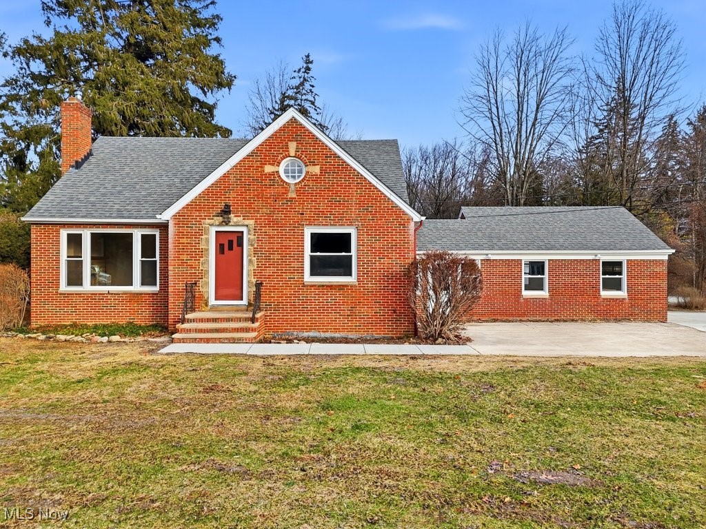 Welcome to this solid, all-brick bungalow in Independence, set on an expansive 100 x 1233 lot (approx. 2.83 acres) with a beautiful, park-like setting surrounded by mature trees.

The main level features a spacious living room with hardwood floors and a wood-burning fireplace, two generously sized bedrooms with hardwood flooring, an updated full bath, and a kitchen with new stainless steel appliances. The adjoining dining area includes new hardwood floors and built-ins. An enclosed breezeway with hardwood floors provides convenient access to the front yard, backyard, and attached two-car garage.

The fully finished upper level offers new HVAC and electrical, a large bedroom with ample closet space, a full bath, a study area, and plenty of additional storage.

The lower level includes a full basement with a finished recreation room featuring new carpet, drywall, ceiling, electrical updates, and a second wood-burning fireplace, along with a laundry area, full bath, and workspace.

Outdoor living is a highlight with a newly added back deck, perfect for morning coffee or evening relaxation, a fire pit, and a cleared, park-like yard ready to explore. The front of the home offers additional parking or potential patio space.

An additional detached 2½-car garage with new siding and gutters provides excellent space for hobbies, storage, or equipment.

Prime location close to major highways, award-winning schools, city amenities, tennis courts, football and soccer fields, state-of-the-art parks and recreation center, indoor and outdoor pools, library, and low property taxes. Excellent city services and more.

Home is being sold AS IS.