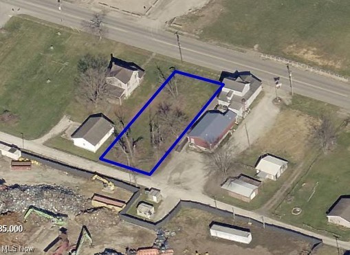 This property is a vacant city lot offering convenient access to I-77, making it an ideal location. The lot dimensions are 66 x 165 feet, providing ample space for use.  City utilities are available.