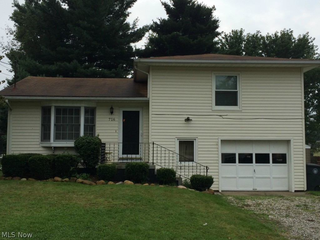 This lovely, well-maintained split-level home has a modern decor and functional living spaces.  The open-concept kitchen, living room, and dining area are located on the main floor.  On the second level you'll discover two spacious, carpeted bedrooms and a full-bath with shower.  The lower level has a half-bath/laundry room combination.  Lower level access to 1-car garage as well.  Basement with updated furnace and water heater.  Additionally, this property is appointed throughout with energy-saving vinyl windows.  The exterior has vinyl siding and spacious fenced-in back yard.  Schedule your showing today!