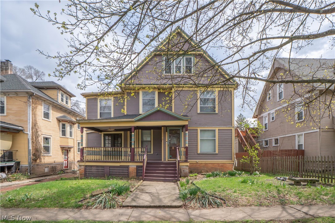 Spacious and full of character, this Colonial offers over 2,400 square feet above grade plus a partially finished lower level for even more flexibility. A large covered front porch welcomes you inside to a home filled with beautiful original charm, including hardwood floors, rich woodwork, pocket doors, built-ins, and an inviting formal staircase. The main level features a bright living room, private office, formal dining room with built-in China cabinets, and a generous kitchen with ample cabinetry, high ceilings, and access to the back deck and fenced yard. A first-floor full bath and convenient laundry room add everyday practicality. A sunroom with fireplace creates a cozy space to relax year-round. Upstairs, you’ll find 4 bedrooms, including a spacious primary with an adjoining bonus sitting area featuring wood-paneled ceilings, skylights, vaulted ceilings, and abundant windows. A second bedroom also opens to its own sunroom, while the upper full bath includes a clawfoot-style tub/shower and updated vanity. The third floor offers a large additional bedroom or bonus space, and the walk-out lower level includes even more room to spread out with its own kitchen area, full bath, bonus room, and storage. Outside, enjoy the deck, fenced backyard, a pond, and plenty of room to make it your own. A unique opportunity with space, charm, and versatility in Akron!