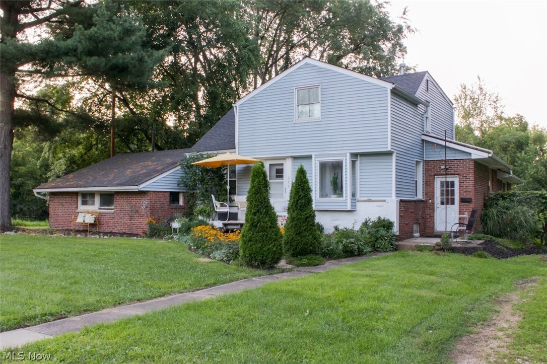 Have you ever dreamed of living on your own private country homestead, but still want to be within walking distance to a vibrant downtown and an excellent rated school? 551 Harris Street is a turnkey micro-farm on nearly a half acre completely fenced with established perennial herb and flower pollinator gardens. There is a secure chick coop and run, everything you need to become a beekeeper, a 16 x 21 metal workshop, 15 foot above ground pool and room to expand your hobbies or home business. This 4 bedroom home in the Historic South End of Kent has a full finished basement (which could be converted into an in-law sweet or apartment for extra income). It is artfully curated with many unique features and modern updates.  The kitchen has quartz countertops and the dual fuel Jenn Air range and refrigerator are included as are the newer washer and dryer.  The family room has a wood burning stove as well as a gas burning stove for those chilly nights. The patio is an entertainer's delight with a new cedar pergola and custom built outdoor bar/kitchen.  This home is the last house on the street and the mature “living fence” not only provides complete privacy and security for children and pets, but also produces baskets upon baskets of Catawba, Concord and Niagara grapes in the late summer.  There are also a variety of fruit trees on the property including Honeycrisp Apple, Cherry, Apricot, Plum and last year’s newest addition, Paw Paw trees which will be bearing fruit within the next few seasons. The property consists of three separate lots which makes the property tax well below other properties of this size.  The railroad owns the lot to the west as an easement and the city owns the right of way to the rear of the property so no new buildings can be built to infringe on your privacy.