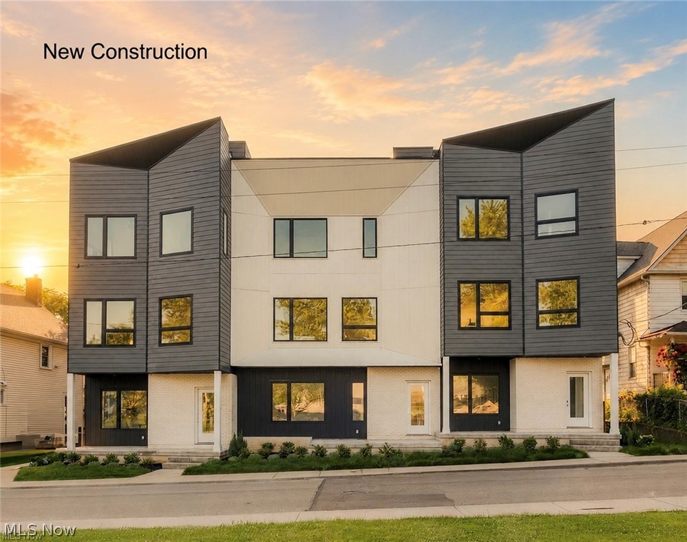 Introducing 'Edgewater South', a Fully Completed townhome with No HOA Fees and WILL meet the eligibility requirements to obtain the old city of Cleveland Full 15yrs of Tax Abatement! This move-in ready elegant townhome with Pella Windows is located at the top of Edgewater Hill & W 74th street, just north of Detroit. The exterior of these homes have a pleasing modern aesthetic that fits perfectly within the neighborhood. This middle unit offers an abundance of living space! The private ground level entry is met by a spacious bonus room/office/bedroom or home gym area & attached two-car garage. The second story offers a modern open concept kitchen, living & dining space with generous finishes including quartz counters with matching quartz backsplashes, premium kitchen cabinetry & energy-star rated stainless appliance package. A powder room along with dedicated dining and living space complete the second floor that is finished in premium LVT flooring. Upstairs the third story offers a loft space perfect for a home office! The owner's suite is completed with a walk-in closet & private en-suite owners bath with Quartz vanity and matching backsplash with double sinks & a large walk-in tile shower. A secondary guest bedroom, additional full bath with shower/tub combo & dedicated laundry space complete the third story. The fourth story offers access to your private oasis. This roof deck is the perfect place to unwind after a long day while enjoying a view overlooking the Detroit Shoreway neighborhood, Lake Erie & Cleveland skyline! Don't miss out on this opportunity! Schedule your private showing today!