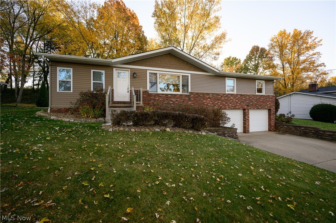 Move in and enjoy the holidays in this 3 bedroom, 2 bath ranch on a half acre lot with great curb appeal. Updated kitchen with leathered granite countertops, ceramic tile backsplash (2020), ceramic tile floor and stainless steel appliances (2019). Living room with vaulted ceiling and beam details opens to the dining room with a slider to the backyard. Enjoy entertaining inside or out on the large patio or TimberTech deck (2018). Sunroom off the kitchen with gas fireplace, solid pine beam floating shelves and access to patio; completely gutted and redone in 2019. 3 Bedrooms and an updated full bath with tile shower finish off the first floor. Beautiful hardwood floors through the living room, dining room, hall, and all 3 bedrooms.  Walkout lower level includes a large family room, lots of storage and a full bath in the laundry room. Detached 2 car garage is heated with a gas furnace, electric and has water available. Attached 2 car garage heated with water and drain. Since 2018, seller