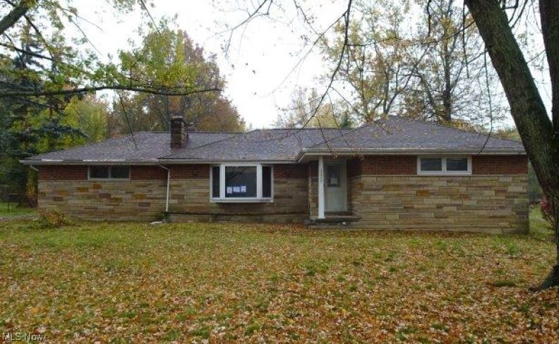 Great opportunity to buy this brick and stone ranch style home built in 1956, located in Richmond Heights, OH and sitting on a 1.157 acre lot with an attached and detached garage.  The interior has 1780 sq. ft. with 3 bedrooms and 1 bathroom plus a full basement.