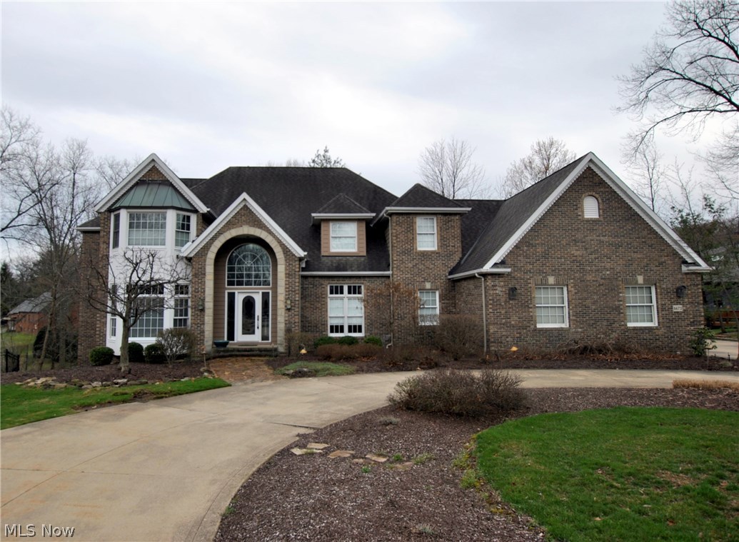 Prime location. Stunning colonial w/park like setting on a private cul-de-sac lot. 4 bedrooms with 3 1/2 bathrooms. 2-story foyer w/hardwood floor. Den w/custom built-ins. Formal dining room w/wood floor. 2-story Great/Family room w/fireplace and custom surround. Spacious kitchen w/tile floor, custom cabinets, large dinette area w/door to outside. Huge owners suite w/glamour bathroom, a walk-in closet, and vaulted ceiling. Finished lower level has a game room and great room plus loads of storage. Private backyard w/custom patio, steps lead to a bridge to open area. 3-car side load garage. Zoned heating and cooling. Circular driveway. A True Must See!