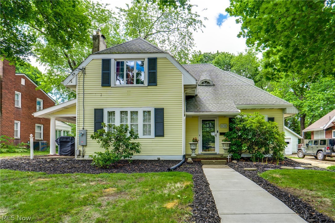 This is the one you have been waiting for! The charm of an older home combined perfectly with fresh and modern updates. Take the driveway to the back of the home and see all of the additional area that was added for parking as well as a great place for pets or children to play with a treed backdrop for privacy. The gorgeous kitchen is a show stopper! Taken down to the studs, you will love the brand new cabinetry, countertops, flooring, appliances, lighting, and more. There is a large formal dining room adjacent to the kitchen with french doors to a quaint covered side porch measuring 10x17. The front living room showcases a fireplace, wood trim, and built-ins for more character. A fantastic feature is the office on the first floor which can also serve as a 4th bedroom with an updated, connected half bath for convenience. The second floor is home to three more bedrooms and another beautifully updated bathroom. One of the many updated features of the home is the laundry hookups that were added to a second floor bedroom making the home even more practical and appealing. The main full bath is fantastic and features a new walk-in shower, double vanity, and ample storage. The new owner won't have much to do since the plumbing, electric with a 200 amp breaker box, water softener, water heater, and garage door have been replaced as well. The HVAC system was updated in recent years for extra peace of mind. Outside, the home has maintenance-free vinyl siding, newer gutter guards on the main home and garage, a cozy front porch for relaxing, and extra patio space at the rear of the home. Let's not forget the 2-car garage with loft storage space and the ideal setting close to Malone University, highways, and all the amenities. Experience for yourself the attention and love that has been poured into this wonderful home!
