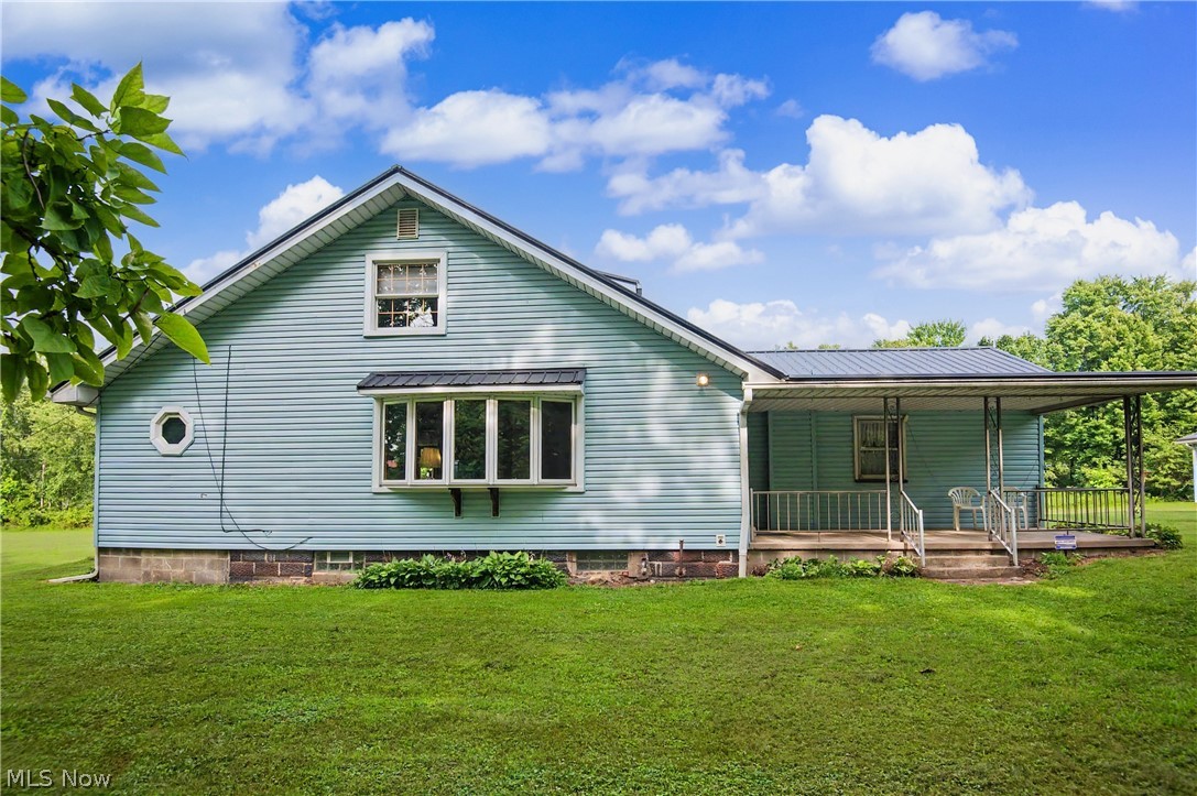 Escape to your own private retreat with this charming 3-bedroom Cape Cod nestled on nearly 9 secluded acres! Tucked far off the road, this well-maintained home offers the perfect combination of privacy, peaceful surroundings, and everyday comfort. Relax on the cozy front porch and take in the beauty of the picturesque property. The home's low-maintenance vinyl siding and newer metal roof provide lasting curb appeal and peace of mind. Inside, you'll find a spacious family room featuring a beautiful bay window with scenic views of the surrounding acreage. The large eat-in kitchen comes complete with appliances and offers plenty of space for family meals and entertaining. The convenient first-floor primary suite includes a private full bath and a walk-in closet, creating a comfortable retreat. Upstairs, you'll find two additional generously sized bedrooms, along with extra storage space. An additional first-floor storage area offers unlimited possibilities for a home office, hobby room, mudroom, or expanded living space. The full basement features glass block windows, a water softener, and professionally completed waterproofing, adding valuable storage and functionality. Car enthusiasts, hobbyists, or anyone needing extra workspace will appreciate the huge 3-car garage with additional storage space. Brand New carpet in living area and master this week!  If you've been searching for privacy, acreage, and a move-in-ready home, this is the one! Don't miss your opportunity to own this beautiful property as homes like this don't come along often! Schedule your private showing today!