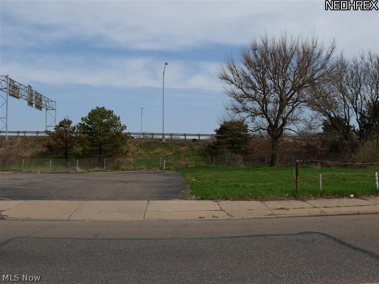 Inside lot on street with sidewalks. Surrounded by commercial lot on one side and vacant residential lot on one side.