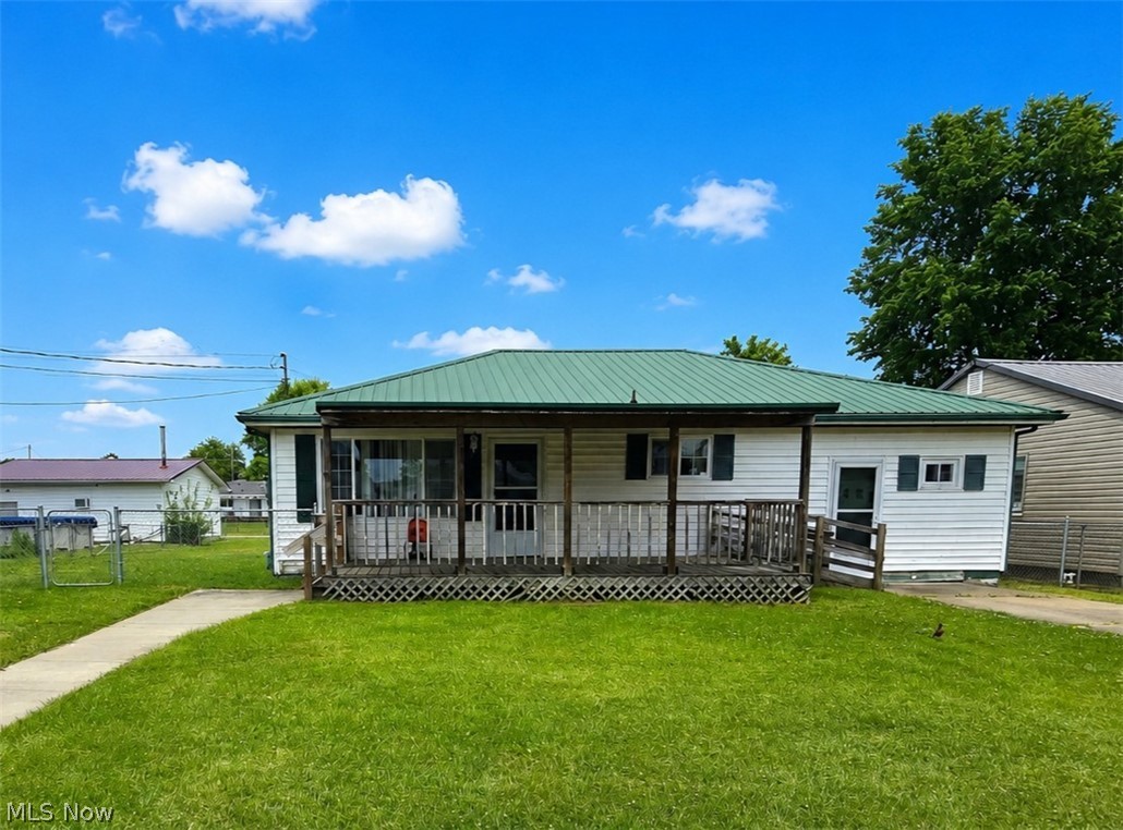 Charming ranch-style home packed with possibilities! This 3-bedroom 1/4 acre property offers solid major updates while leaving room to add your own personal touch. Recently improved with a hot water tank only 2 years old and HVAC system approximately 1½ years old, helping provide peace of mind for years to come. Previously HUD inspected and zoned for daycare use, this property presents a unique opportunity for investors, business owners, or buyers needing flexible space. The fully fenced rear yard features secure gated access, including a double rear gate from the alley and a single front gate for added convenience. Outside, you'll find a durable metal roof and a spacious 12x20 storage building complete with attic storage space—perfect for equipment, hobbies, or additional storage needs. Whether you're searching for a starter home, rental investment, daycare opportunity, or a property to update and customize, this home offers excellent potential in a functional layout with valuable exterior features already in place.