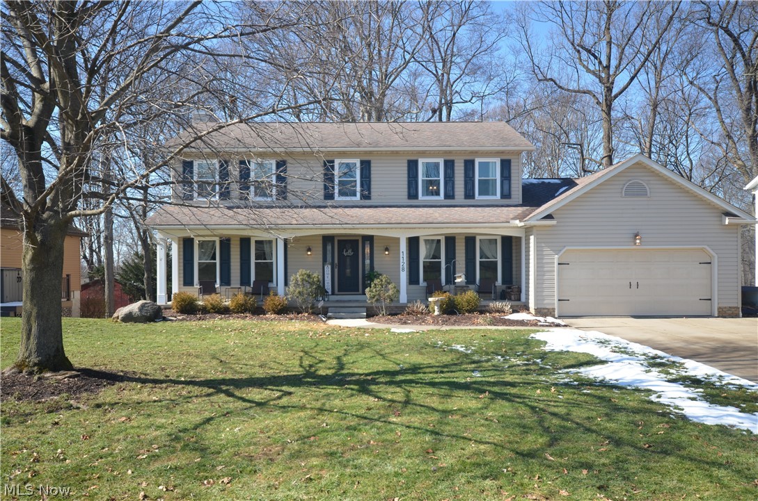 CANCELED -OPEN Sun 3/1 12:00-1:30 Property Under Contrat!  Incredibly updated Tallmadge Highlands 4 Bedroom 2.5 bath w/ finished walkout basement, massive mudroom/laundry area, a fully fenced backyard w/ privacy fence, 3-tiered deck, and a large front porch.  Inside you’ll be greeted by brand new luxury plank flooring that flows throughout the main floor. Walk through the foyer past the flex room and dining room to the open family room, eating area, and kitchen. The family room, with wood-burning fireplace (gas stub if desired), connects to the eating area. The Pella sliding door leads to the 3-tiered deck out back. The spacious kitchen has granite countertops and has been updated with resurfaced cabinets with soft close drawers and doors. Behind the first-floor half bath, you’ll be amazed at the remodeled mudroom/laundry room with built in cubbies! The entrance to the 2-car attached garage is found right off the mudroom area.  Upstairs you’ll be impressed with 4 generous sized bedrooms. The owner’s retreat is complete with updated ensuite bathroom and walk-in closet with closet organization system.  The remaining three bedrooms are served by a full bath with a solid surface vanity w/ double sinks. Heading back down to the basement, you will find endless possibilities for the two large, finished rec rooms, along with plenty of storage and convenient walk-out access to the patio in the backyard which includes a storage shed and playset that stays! You will find updated lighting and windows throughout the home. Other updates include: New Doors, Rheem Tankless Hot Water Heater, commodes, siding & roof.  This home truly is a must see!  Possession no earlier than 5/15/26.