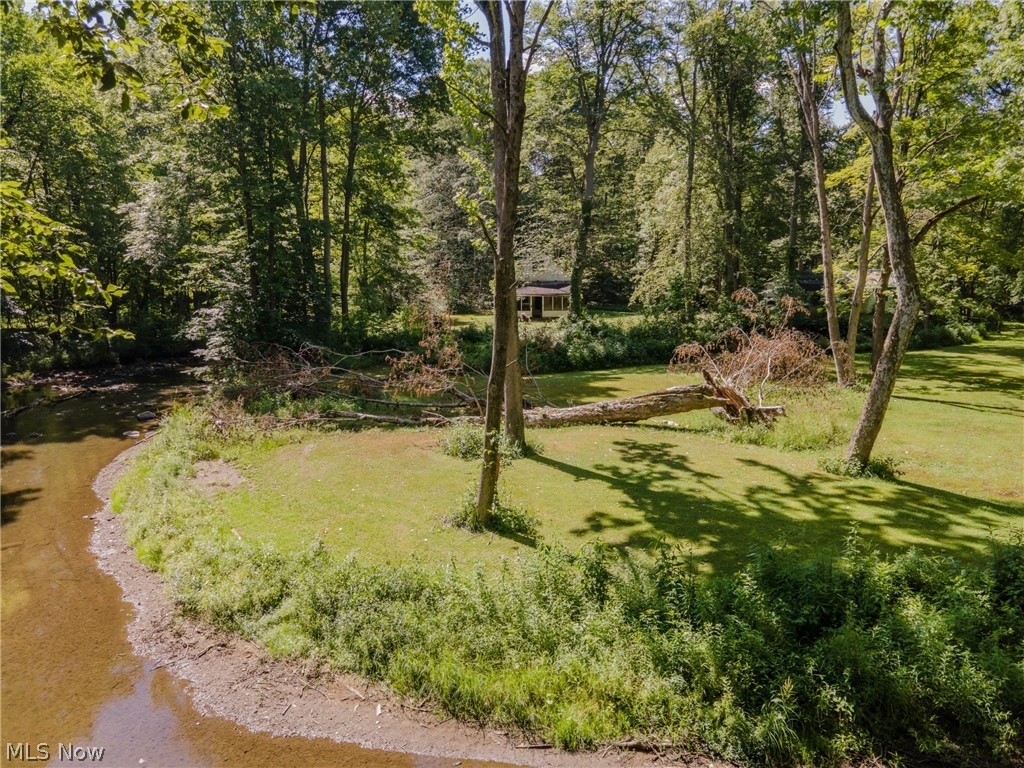 Looking to build your dream home or just would like a serene piece of river front property? Your search is over! What was once a private club in the early 1900's, can now be your own oasis! Nestled perfectly, this land is far enough to be a 100% private escape, but close enough to Fairmount & 306 that you're never more than a few moments from anything you may need! Split by the Chagrin River, this 7.17 acre paradise is ready for it's next chapter. This property offers the perfect combination of private woods & cleared open areas, while also offering river views & access! The two buildings on the property will more than likely need to be torn down, but there is electric, a well, & septic system ready to be upgraded for your new home. Don't miss this amazing opportunity!