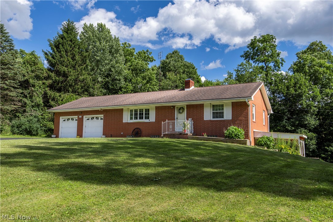 Discover the peace and privacy of country living in the highly desirable Triway Local School District. Situated on 4.6 scenic acres, this brick ranch offers a rare opportunity to own a beautiful property featuring mature woods, a meandering creek, and plenty of open space to enjoy nature, recreation, or simply unwind. The land is the true centerpiece, providing a picturesque and private setting with endless possibilities for outdoor recreation. Enjoy watching the abundant wildlife from your own property, with an existing tree stand offering the perfect vantage point for nature observation or seasonal hunting. Whether you're seeking a peaceful retreat, room to roam, or land to enjoy throughout the changing seasons, this property offers a setting that's increasingly hard to find.
Inside, you'll find lovely hardwood floors, an eat in kitchen, and a spacious finished walkout lower level. A 2-car attached garage is complemented by a 24' x 24' outbuilding with workshop space, providing ample room for hobbies, equipment, or extra storage. Other features include two full baths, a cozy fireplace, and a generator hookup. If you've been dreaming of acreage, natural beauty, and the charm of rural living while remaining conveniently close to Wooster's amenities, this is a property you won't want to miss.