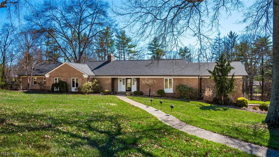 Welcome to this exceptional 3,492 sq. ft brick ranch, perfectly situated in one of the area's most desirable neighborhoods on 2.4 acres. This home blends timeless craftsmanship with generous living spaces, offering comfort, privacy, and an ideal layout for both everyday living and elegant entertaining. Highlights include a fully remodeled kitchen with ample cabinetry along with a custom cracked tile backsplash by Fioriware and granite counters.There is a sub zero refrigerator, Zline gas cook top, dishwasher, double ovens, micro-wave and a wine refrigerator. The kitchen offers a large island for dining plus an area for a kitchen table. The laundry closet is located in the kitchen for convenience. The spacious family room has a vaulted wood ceiling and expansive windows on the west side of the home. The dining room offers large windows that look out onto the rear of the home along with access to the all season room.The living room is spacious and has a gas fireplace. There is a charming half bath near the foyer. The study offers may built ins for extra storage. The primary bedroom suite is very spacious with large windows and a dressing area that includes his and her closets. The bathroom has been updated with a dual vanity, walk in shower, a Kohler whirlpool tub and marble flooring. The home has 3 large guest bedrooms and 2 full bathrooms. The bathrooms have been updated and one has a skylight. There is a spiral staircase that leads into the basement family room with great windows for natural lighting. The unfinished side of the basement has a 2 car garage (both new doors) and an abundance of storage space. A new roof and copper gutters were installed in 2023.The exterior paint on the house and the all season was completed in 2022.Most of the doors and windows (Pella) have been replaced.The sellers added a whole house generator and a 2 car detached garage with attic storage.The home has 3 separate HVAC systems and 2 water heaters. There is a whole house generator.