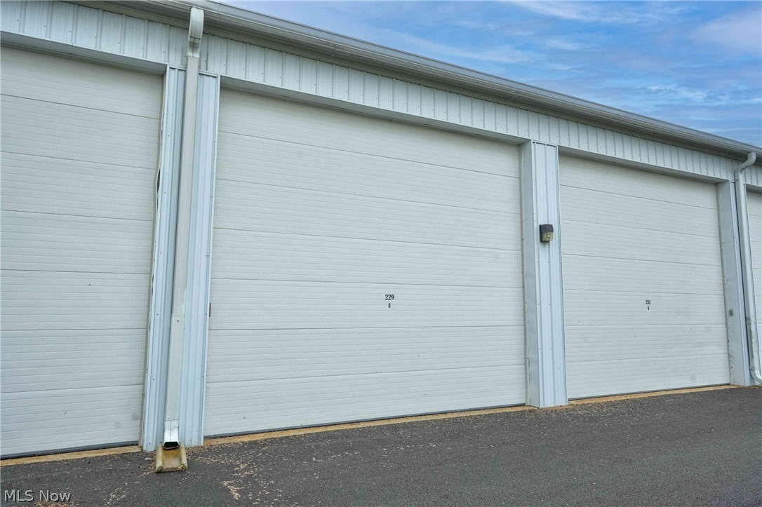 18' x 45' | 810 Sq Ft Storage Condo with Large Loft & 14' High Door!  This well-located 810 square foot storage condo offers excellent functionality and convenience. Measuring 18' x 45', the unit features a large loft for extra storage space and a 14-foot high door — ideal for oversized vehicles, boats, RVs, equipment, or trailers.  Prime Location — Just off Route 2 at the SR 2 / SR 53 (S.E. Catawba Road) exit. Route 53 SE Catawba Road is a main artery leading to Catawba Island, Port Clinton, Lakeside, and Marblehead. The condo is only 2–3 minutes north of the SR 2/SR 53 interchange, offering quick and easy access for commuters and recreational users alike.  HOA dues are approximately $84.50 per month and include electric!  This is an estate sale. The unit will be emptied before closing. The interior photo has been edited to remove clutter and better showcase the size and layout of the unit.