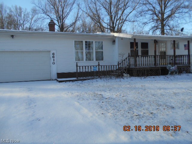 Beautifully remodeled 3 Bedroom 1.5 Bathrooms with 2 car attached garage situated on 3.33 acres.  Kitchen has wood cabinets with an eat in area.  Convenient beverage frig .  Just passed the  kitchen is the sun room that has a deck for relaxing and viewing the scenery.  Living room has a fireplace that will keep you comfortable.  Laundry area is in the sun room for easy access.  All mechanics are less than 4 years old.  Stop in to tour soon...this will not last long!!!