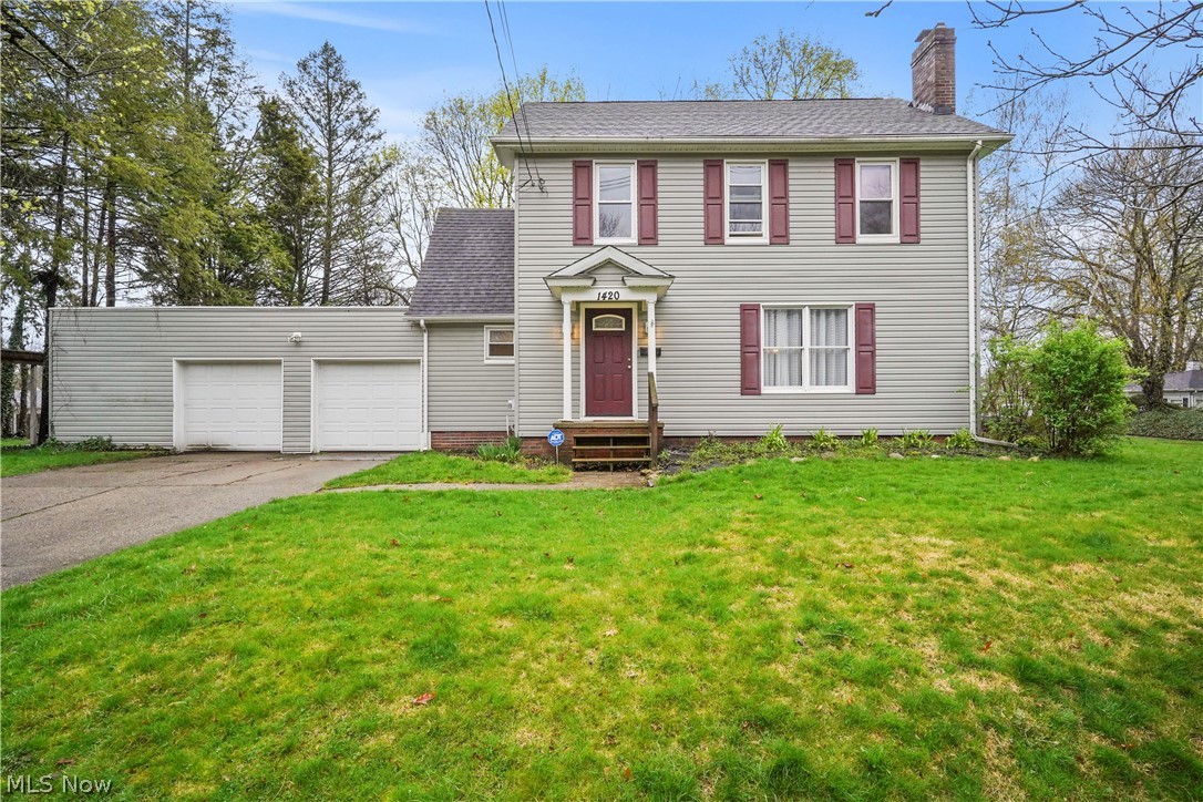 Picture a colonial-style home full of charm and character!  The spacious living room offers a woodburning fireplace with beautiful wood trim and brand new carpeting. The dining room is also good size.  The kitchen is bright and includes all the appliances.  There's even a quaint, cozy reading nook or breakfast room that exudes warmth and comfort with lots of windows allowing for an abundance of light.  Enter the 3 season sunroom, which leads to the deck that extends the living space outdoors - perfect to enjoy grilling, entertaining and basking in the sunshine.  A drop zone/mud room area off the attached 2+ car garage and powder room complete the first floor.  The second floor features 3 bedrooms, office/bonus room and full bath and there's even a 4th bedroom on the third floor.  The basement is partially finished and offers a 2nd fireplace.  Lots of storage in the basement with built ins and a separate room.  Bonus - there is a huge room off the 2 car garage that could be a perfect workshop or more storage.